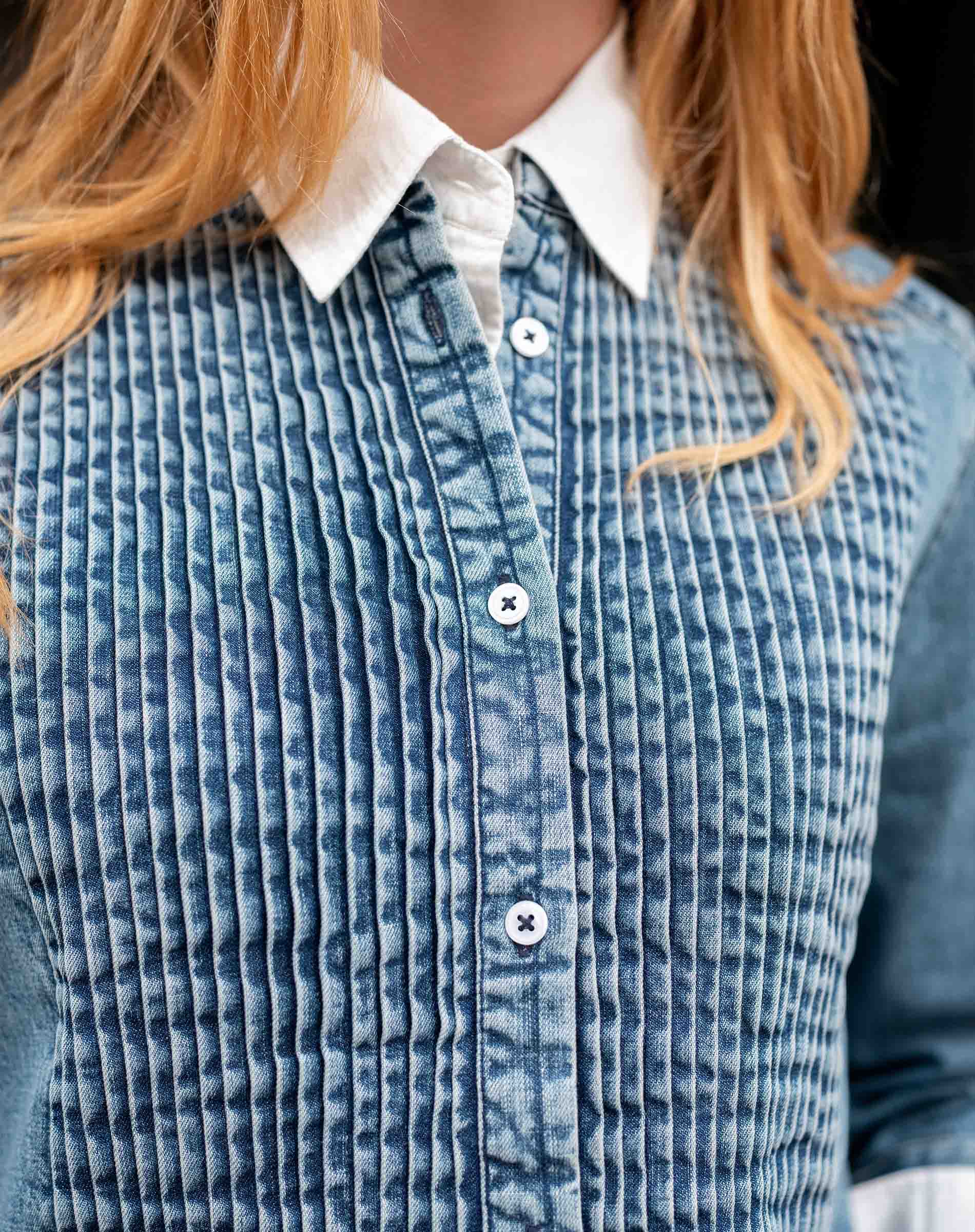 Stonewashed chambray tuxedo shirt with pleated front detail.