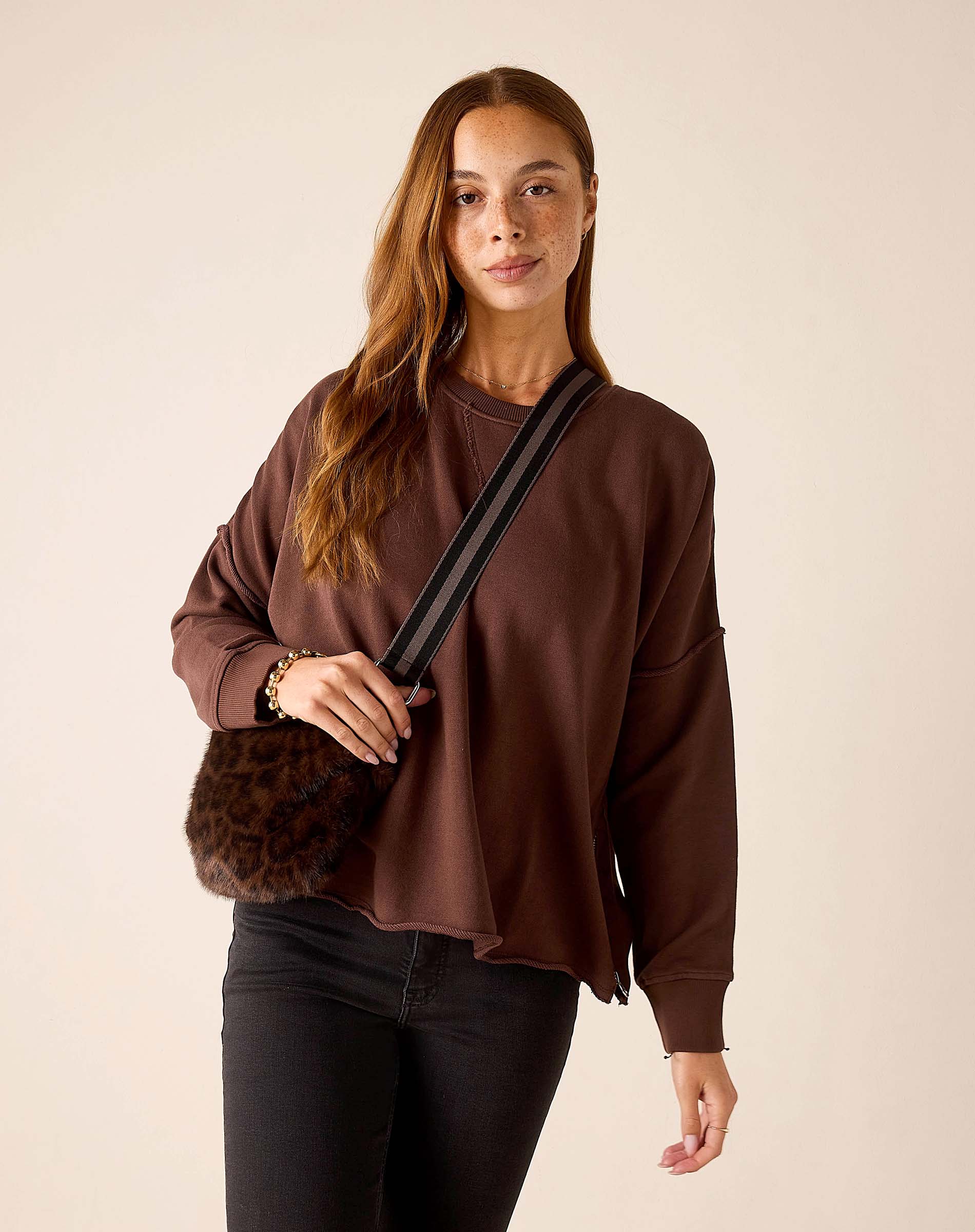 Leopard print faux fur crossbody bag in mocha brown.