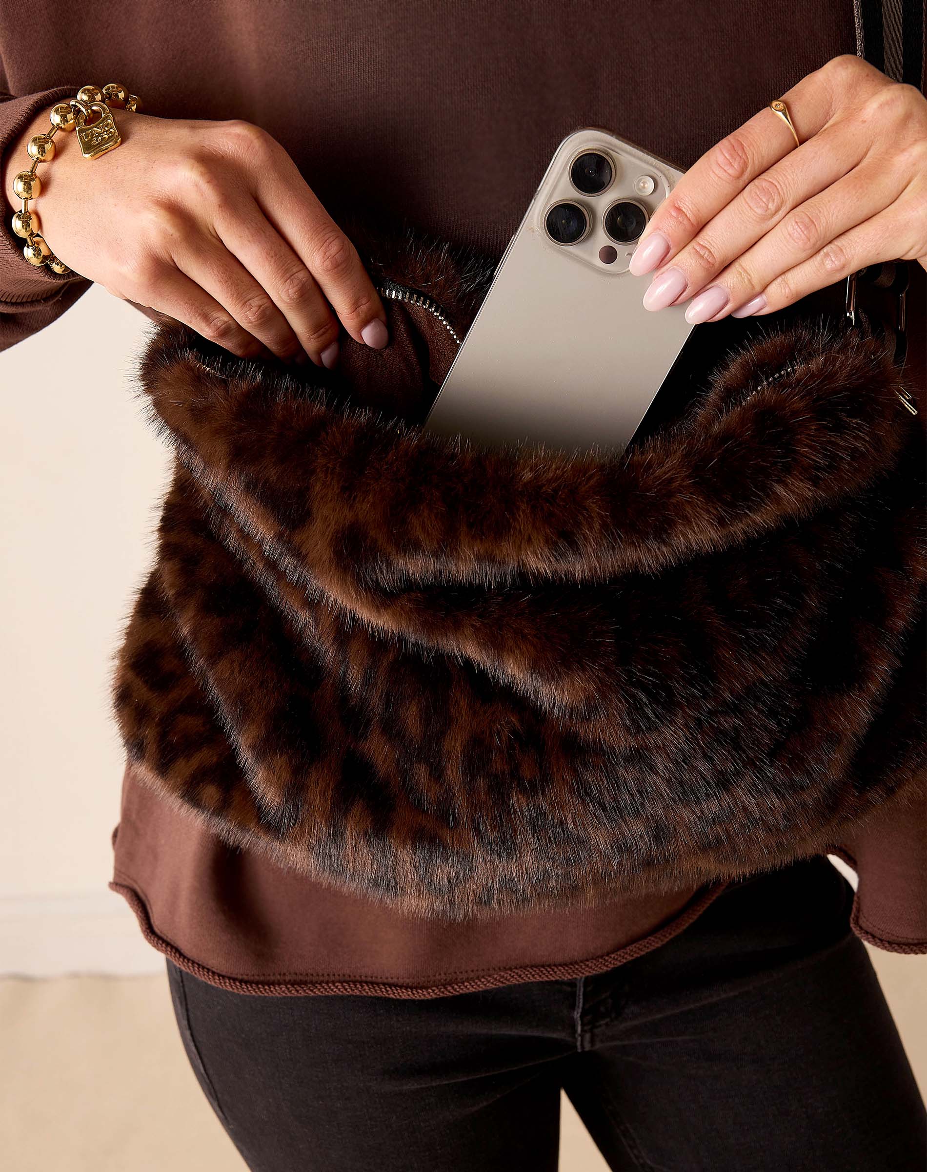 Leopard print faux fur crossbody bag.