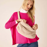 Oatmeal faux fur crossbody bag with a slouchy silhouette and wide shoulder strap.