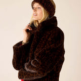 Leopard print faux fur headband in chocolate brown.