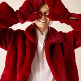 Ladies' travel-ready garnet faux fur mittens.