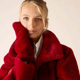 Garnet faux fur coat with a large collar.