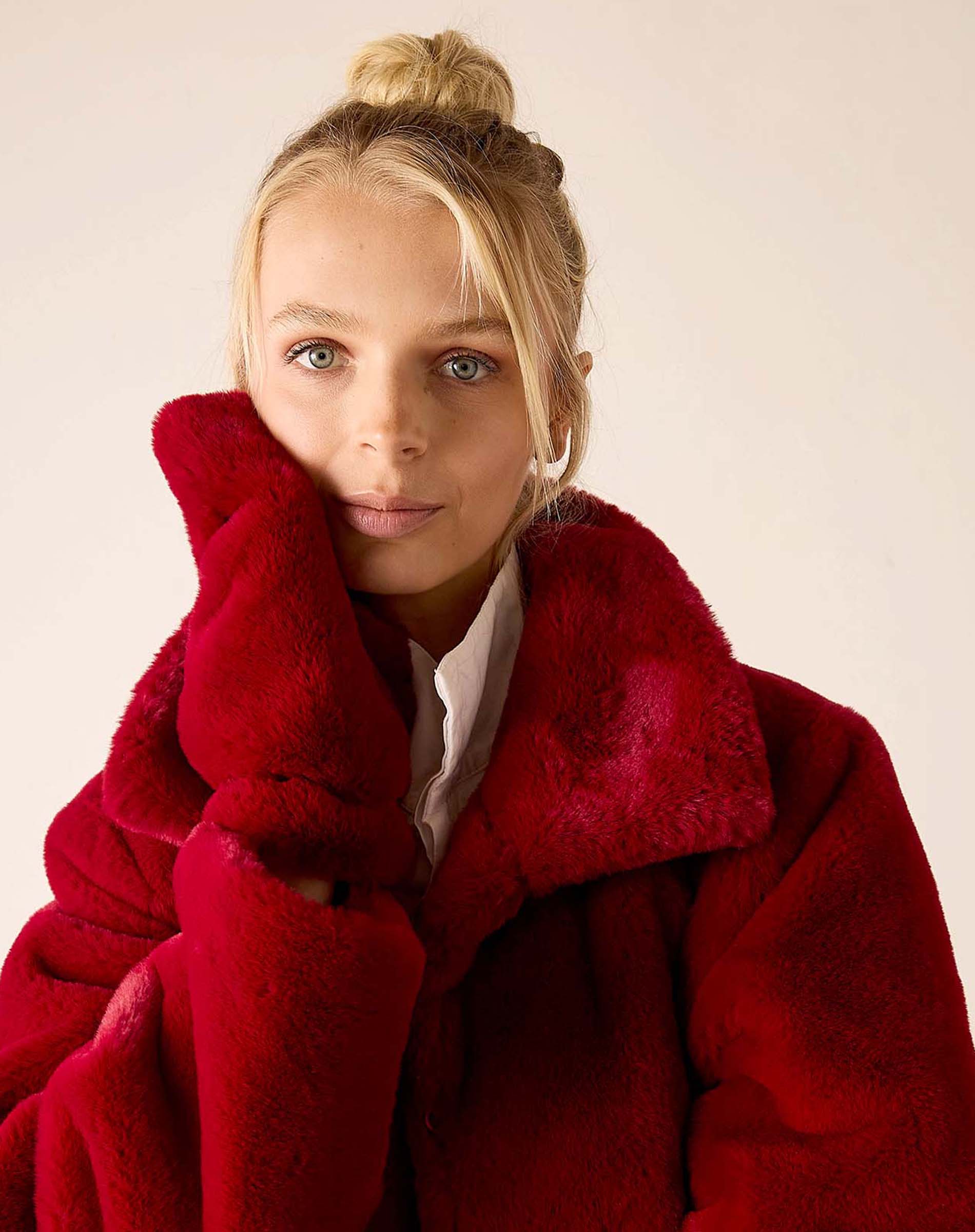 Garnet faux fur coat with a large collar.