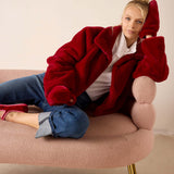Garnet faux fur mittens with a cozy fit and plush finish.