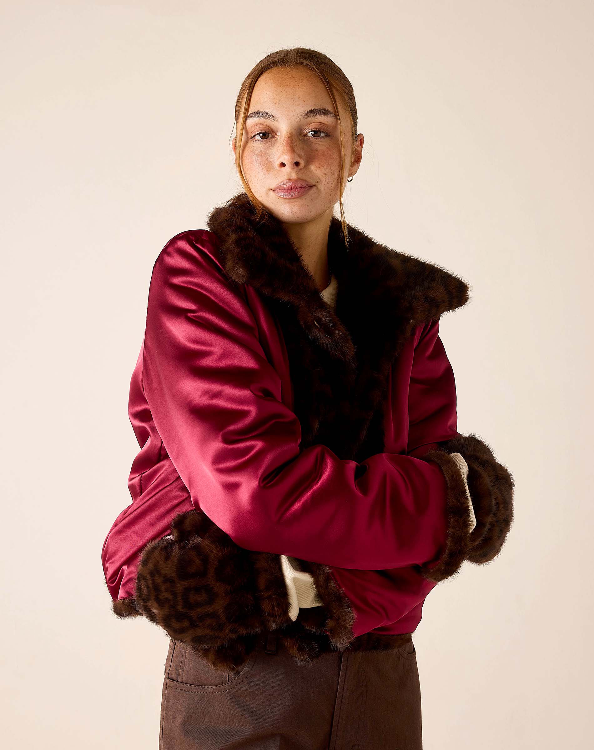 Women's travel-friendly leopard print faux fur mittens in deep berry and brown.