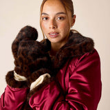 Leopard print faux fur mittens in dark brown and tan.