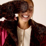 Leopard print faux fur mitten in dark brown and black.