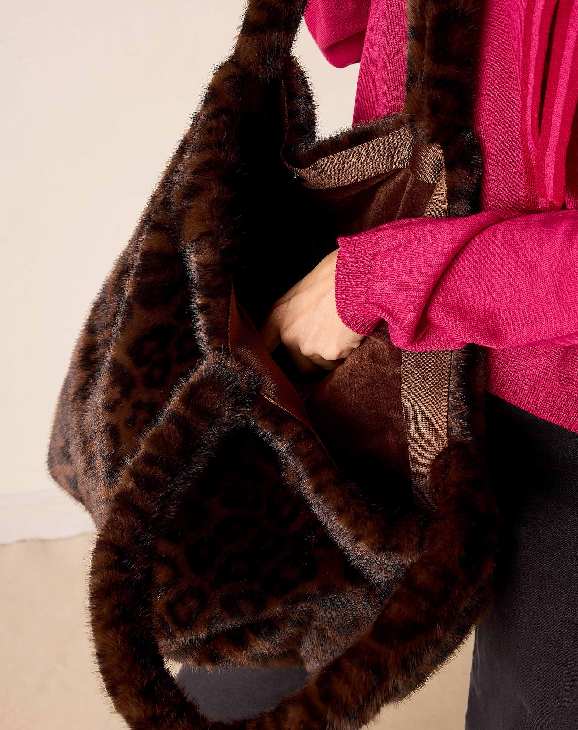 Brown leopard print faux fur tote bag with plush trim.