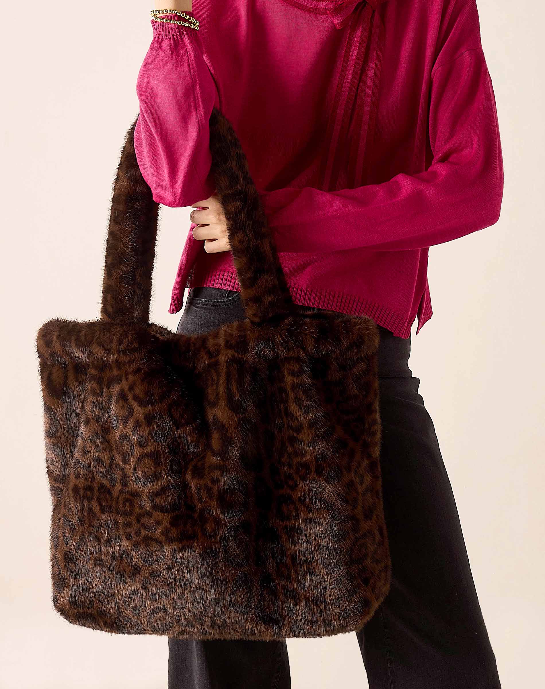 Leopard print faux fur tote bag.