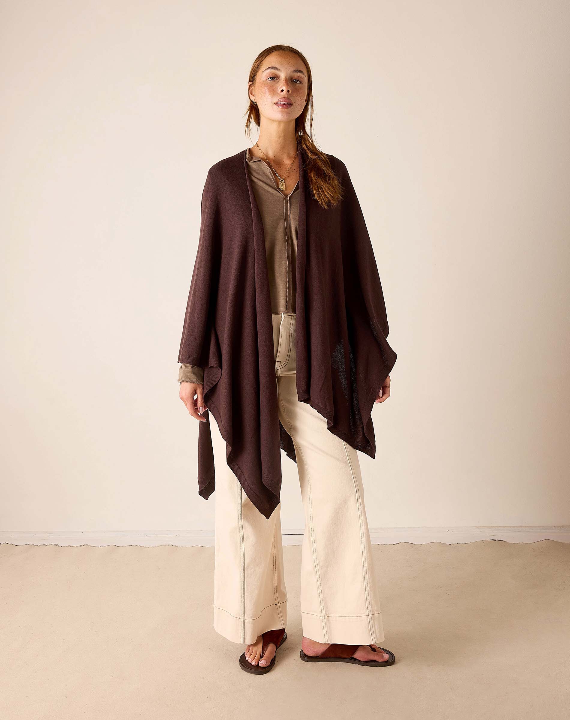 MERSEA women's travel-friendly chocolate brown wrap with a draped, oversized fit and flowing sleeves.