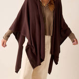 Chocolate brown draped travel wrap with long edges and soft knit texture.