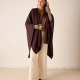 Chocolate brown wrap with a draped silhouette and long sleeves.