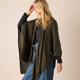 Olive wrap with longer back hem and open front for easy travel layering.