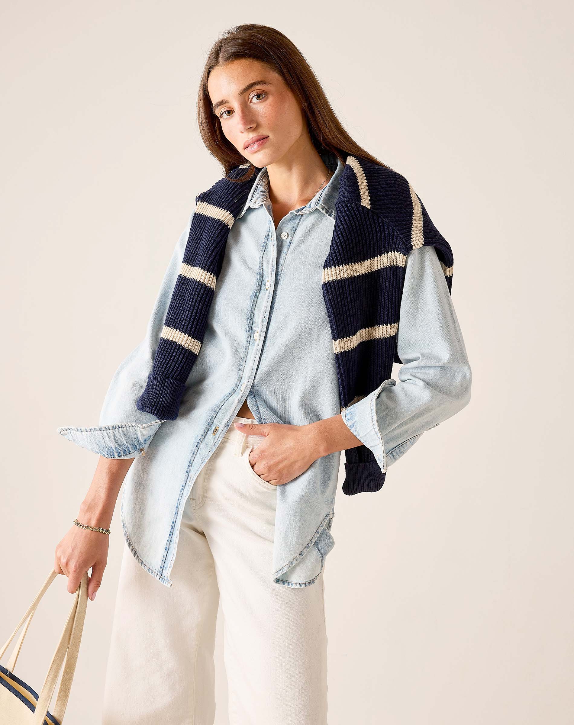 MERSEA ladies' travel-ready light blue button-up shirt paired with a navy and cream striped knit wrap.