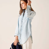 Light blue button-up shirt with a relaxed fit and long sleeves.