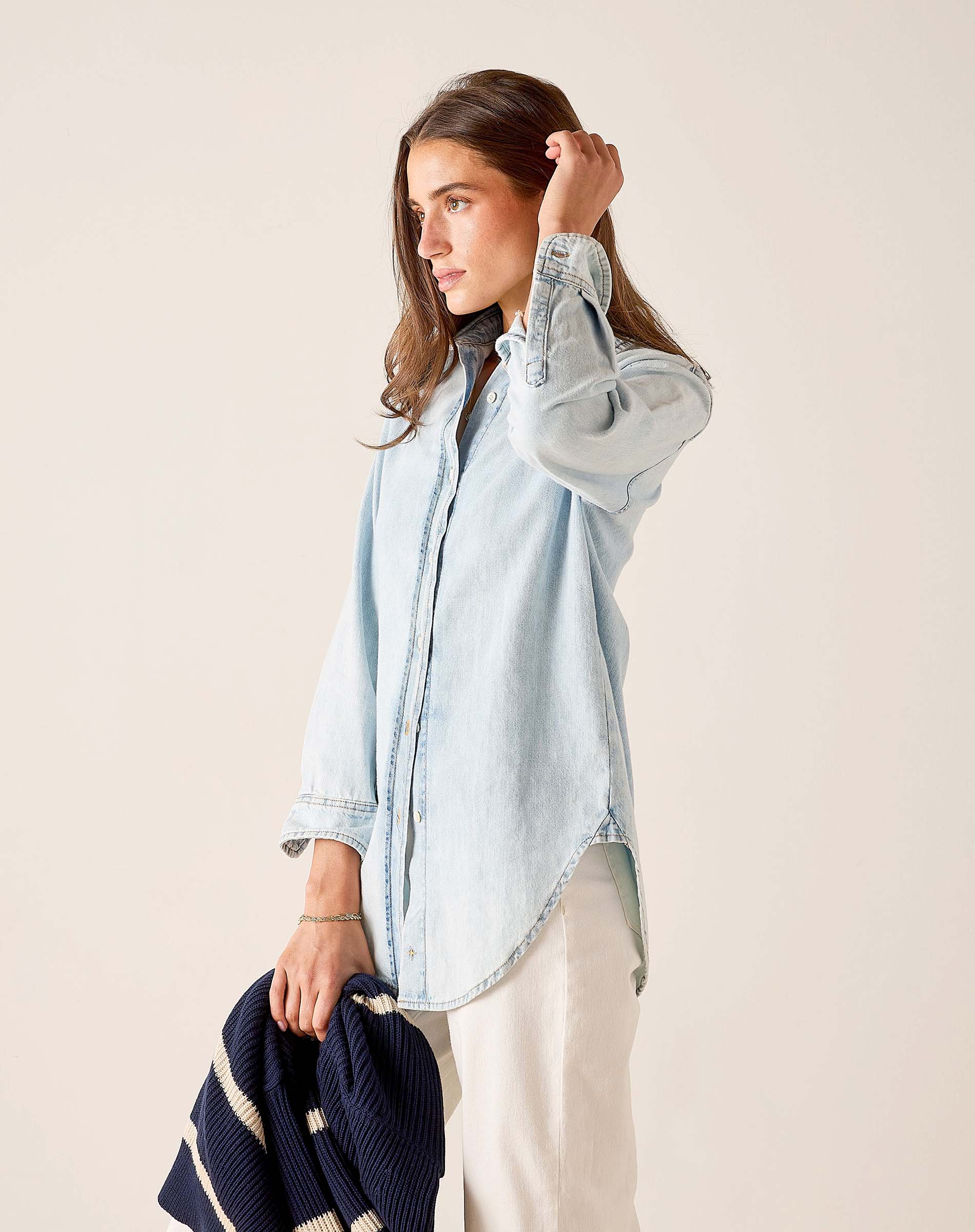 Light blue button-up shirt with a relaxed fit and long sleeves.