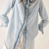 Light blue button-up shirt with a collar and long sleeves.