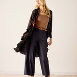 Women's travel-friendly chocolate brown ruffled kimono with wide leg trousers and belt.