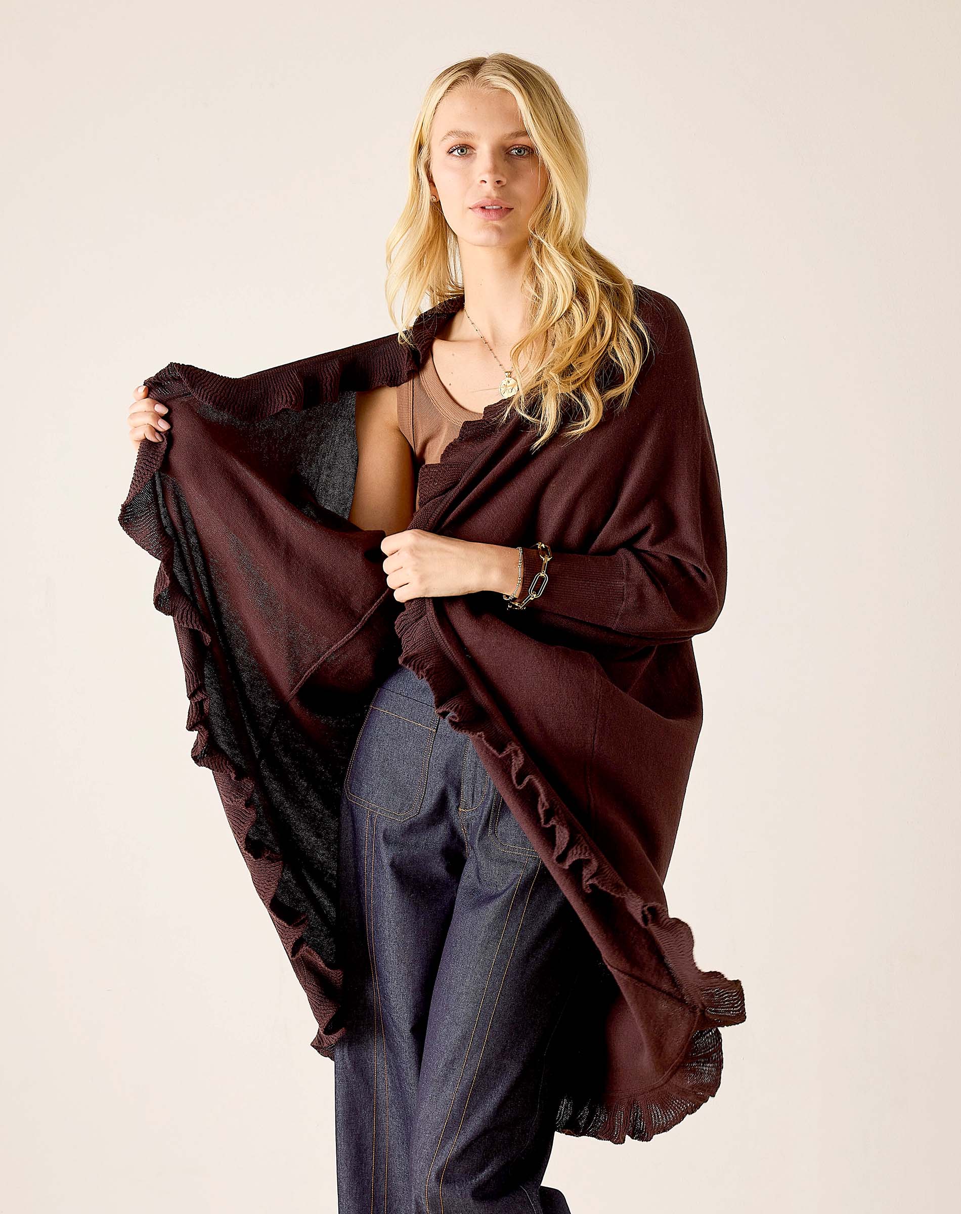 Chocolate brown ruffled kimono wrap with wide sleeves and a flowing silhouette.