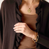 Chocolate brown knit kimono with ruffle trim and a soft, draped feel.