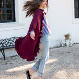 Wine-colored ruffled kimono wrap with a flowing silhouette and flared hem.