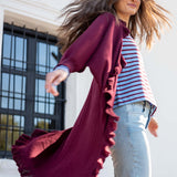 Vino-colored ruffled kimono wrap with a flowing silhouette and wide sleeves.