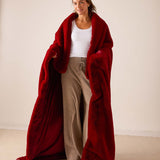 Garnet red faux fur throw wrap with plush pile.