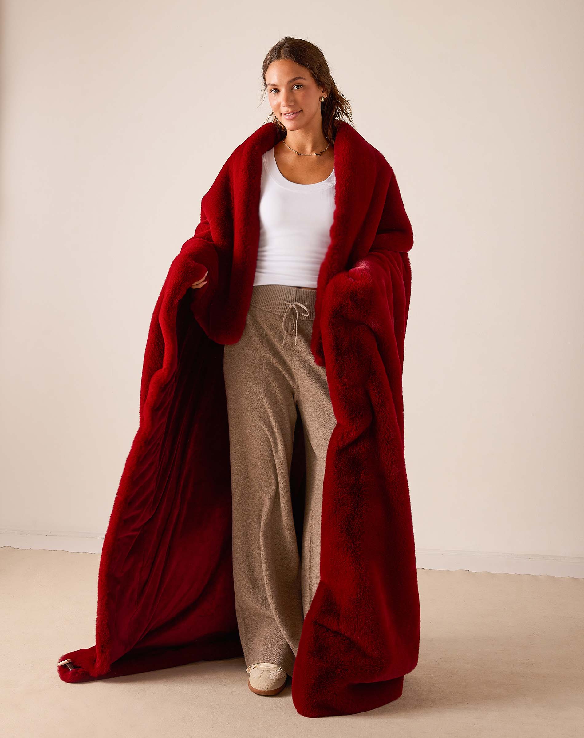 Garnet red faux fur throw wrap with plush pile.