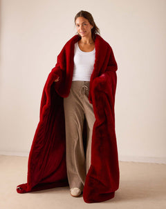Garnet red faux fur throw wrap with plush pile.