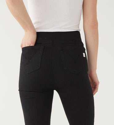 female wearing white tank and black jeans zoomed in on the back pocket on a white background