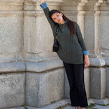 Ladies' travel-ready army green cable-knit oversized sweater with folded cuffs.