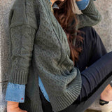 Army green chunky cable knit sweater featuring a relaxed fit and oversized cuffs.