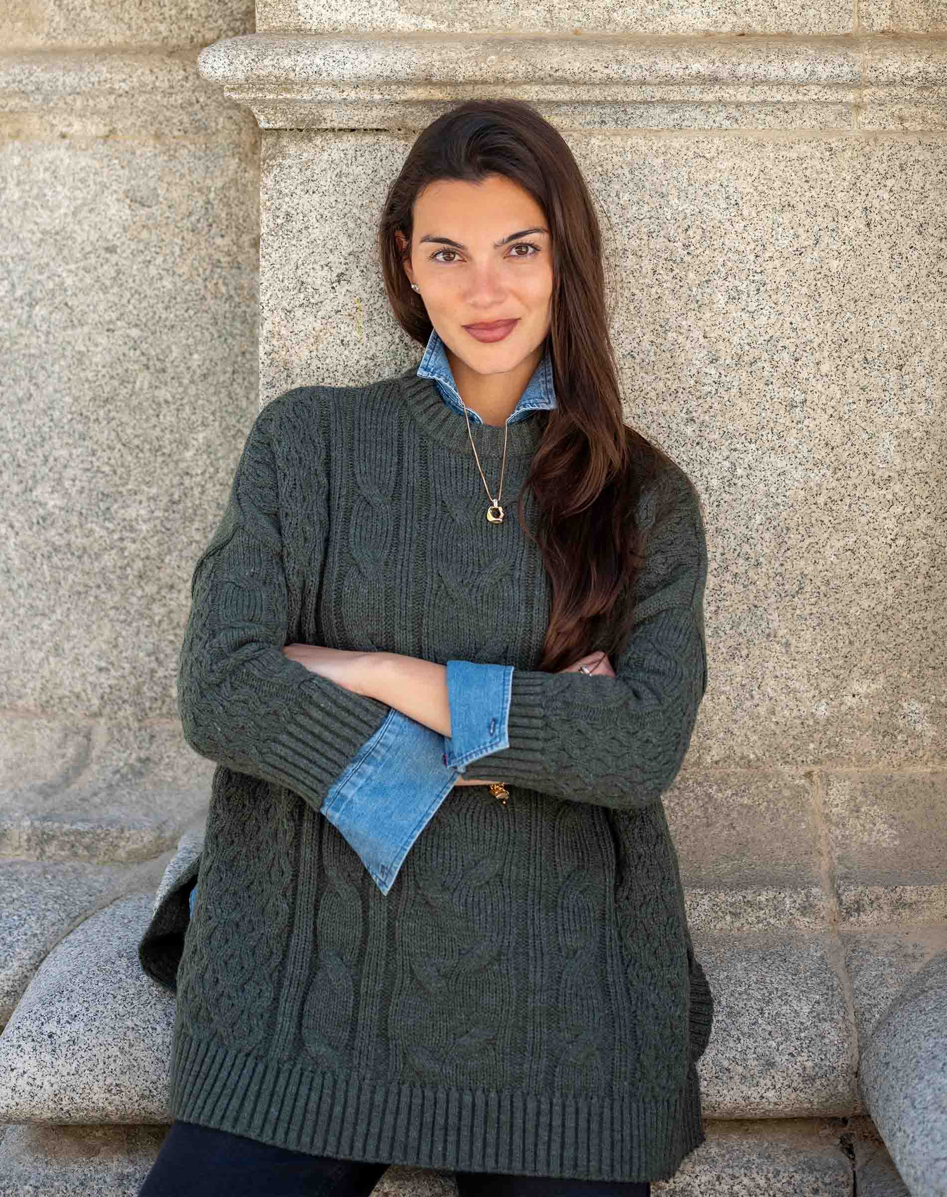Army green cable-knit oversized sweater with a buttoned collar and denim lining.