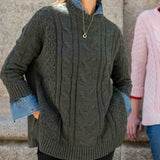 Army green cable knit oversized sweater with pockets and denim lining.