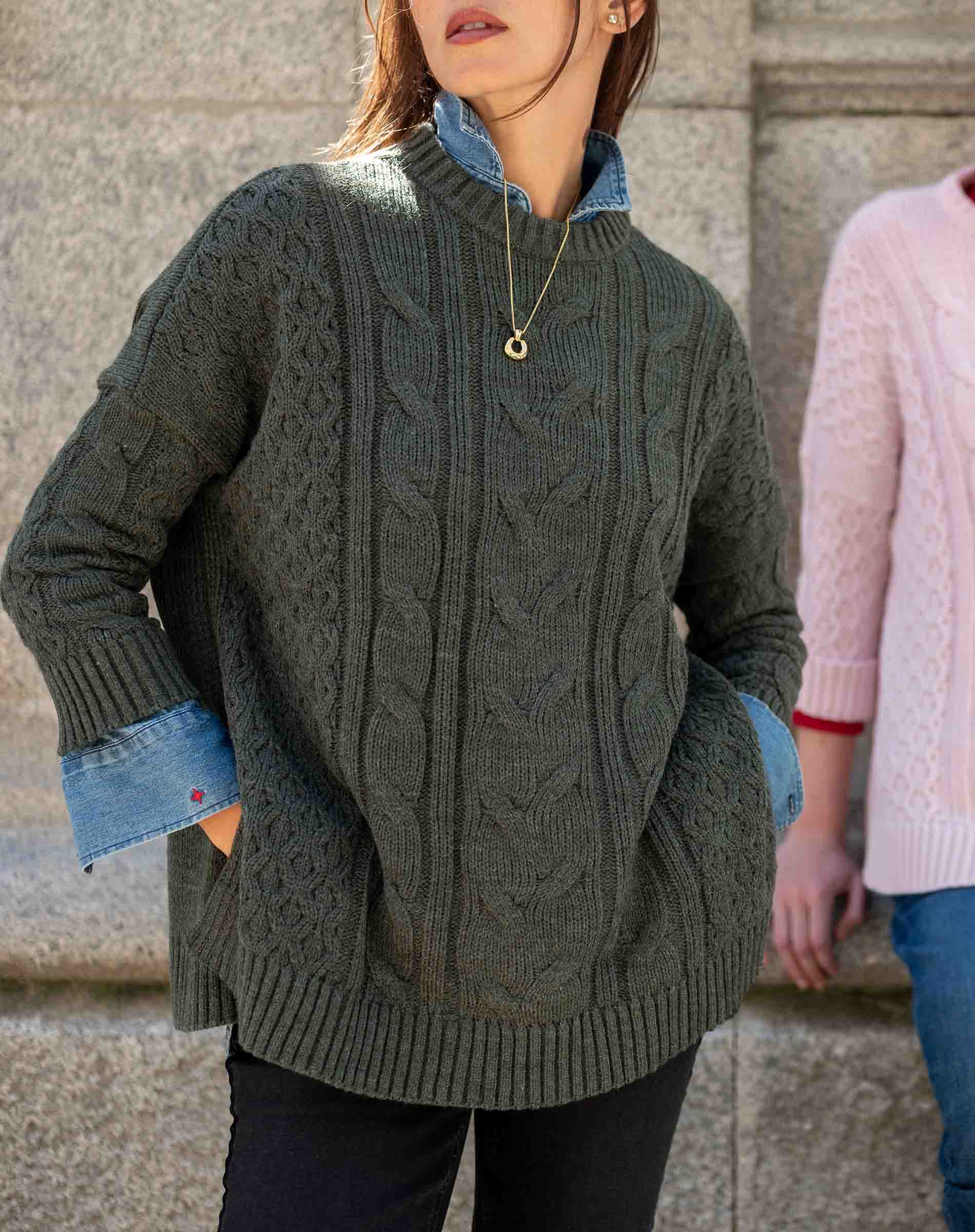 Army green cable knit oversized sweater with pockets and denim lining.