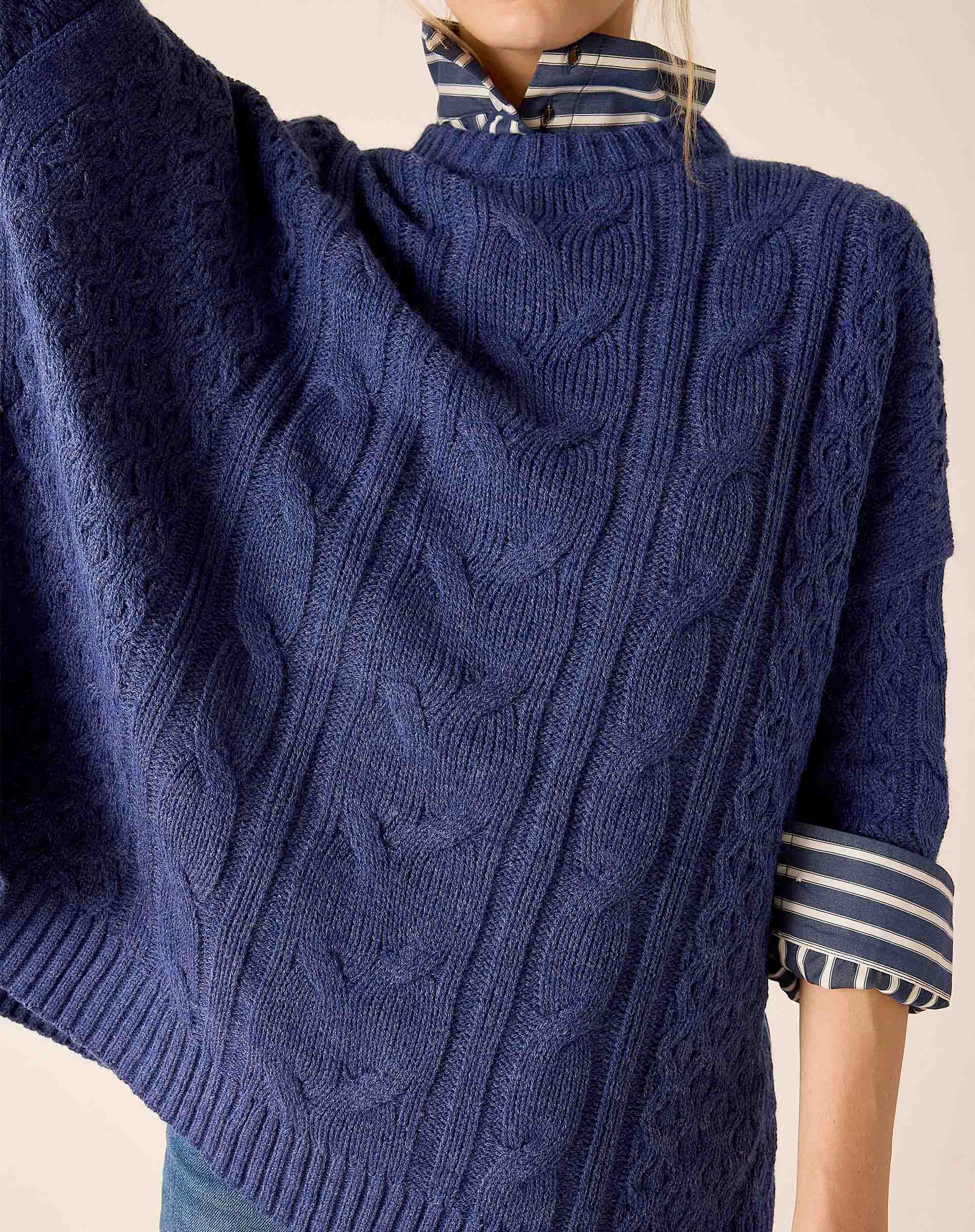 Women's travel-friendly dusk blue cableknit knit sweater with a textured weave.