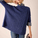Dusk blue cable knit sweater with wide striped cuffs.