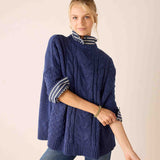 Dusk blue cable knit oversized sweater with striped neck and cuffs.