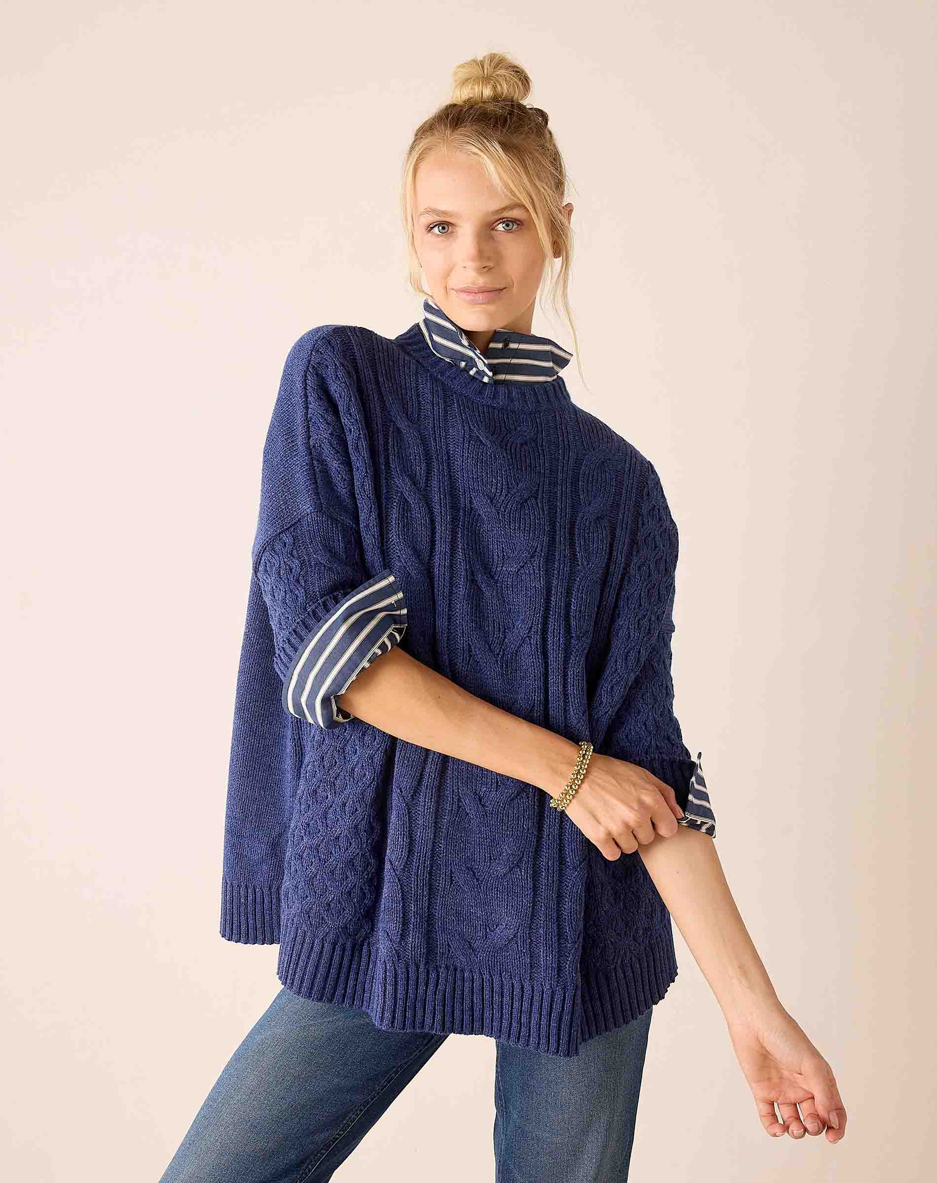 Dusk blue cable knit oversized sweater with striped neck and cuffs.