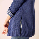 Dusk blue cable knit sweater featuring an oversized fit and a wide ribbed hem.