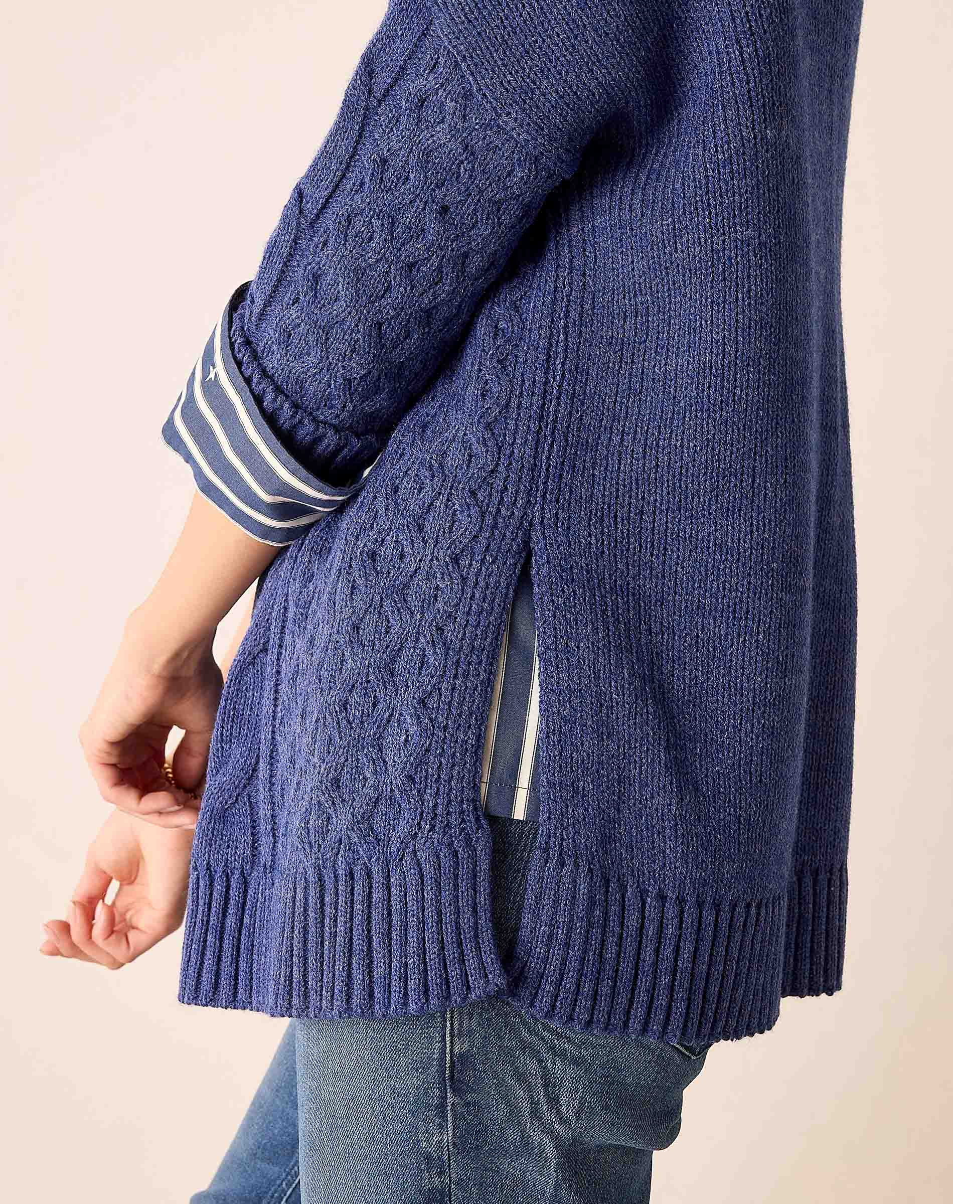 Dusk blue cable knit sweater featuring an oversized fit and a wide ribbed hem.