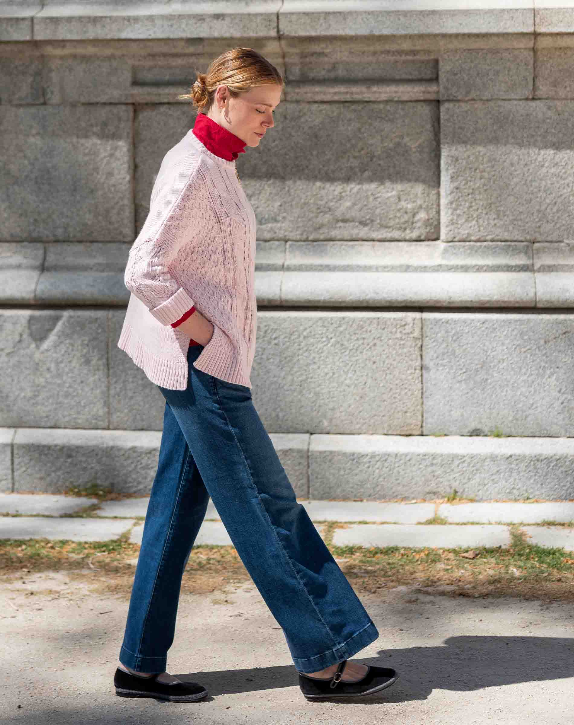 Petal pink cableknit sweater with a textured knit finish.