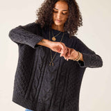 Charcoal cable knit sweater with ribbed cuffs and hem.