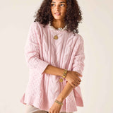 Ladies' travel-ready light pink cable knit Cotswold sweater with a pointelle stitch detail.