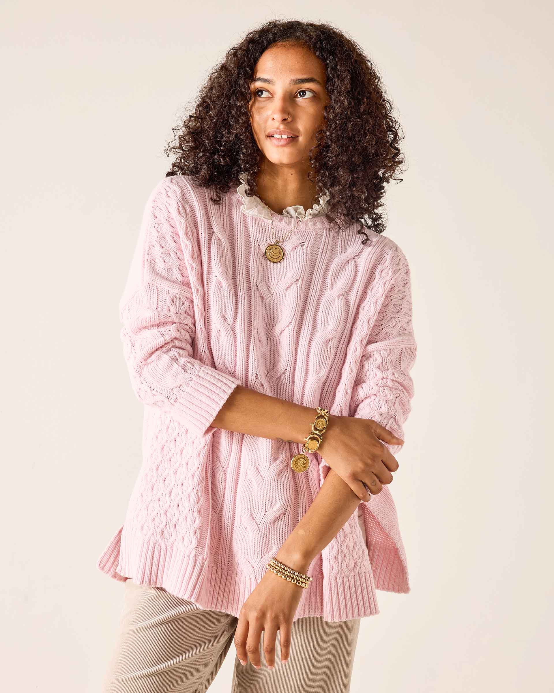Ladies' travel-ready light pink cable knit Cotswold sweater with a pointelle stitch detail.