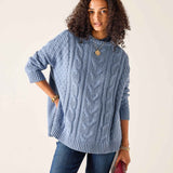 Ladies' travel-ready misty blue oversized cable knit sweater.