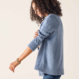 Misty blue ribbed knit sweater with textured paneling and wide ribbed cuffs.