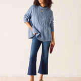 Misty blue cable knit sweater with a relaxed fit and ribbed hem.