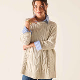 Ladies' travel-ready sea salt oversized cable knit sweater with layered collar and cuffs.